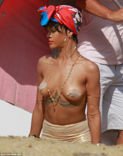 Well she is a Bad Gal! Rihanna reveals boobs with tape as she poses topless for Vogue Brazil in beach photoshoot&#8230;#1