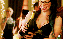 alex vause licking bottle of champagne gif