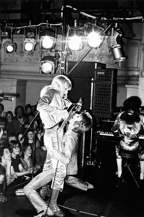 Mick Rock
Mick Ronson &amp; David Bowie. Oxford Town Hall (1972)