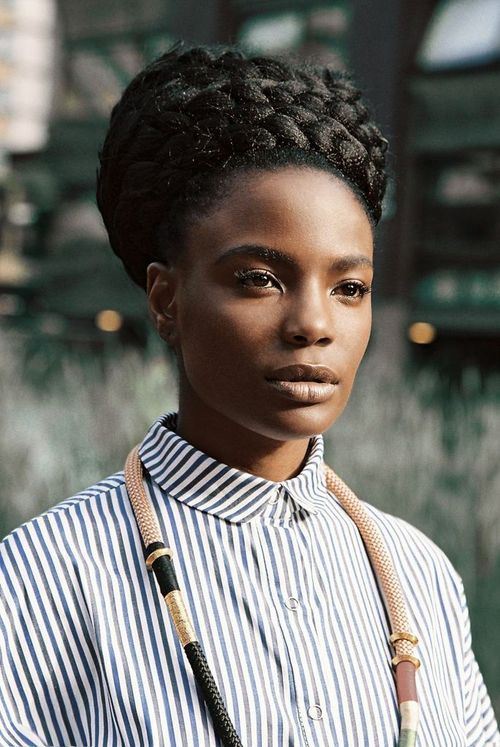 tomboybklyn:

stripped button up, beautiful braided up-do, and awesome african cord necklace…so good