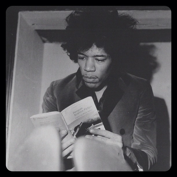 Jim Hendrix reading a Penguin Science Fiction paperback