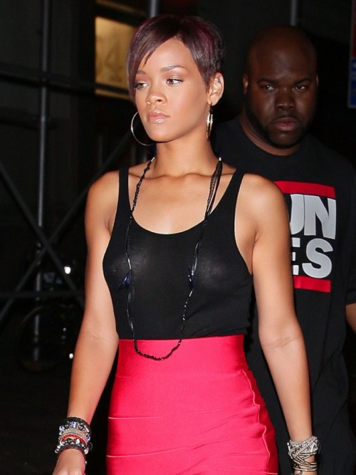 Rihanna is really rockin that pink skirt and that see-thru top is the story here&#8230;check out the nip ring&#8230;
