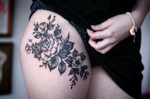 Flower skull thigh tattoo