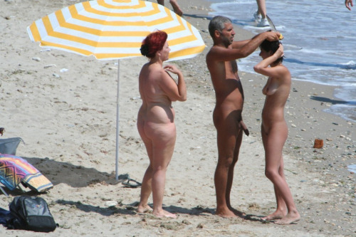 Nudist family at nude beach erection