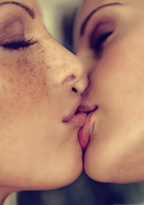 Man kisses girls lips