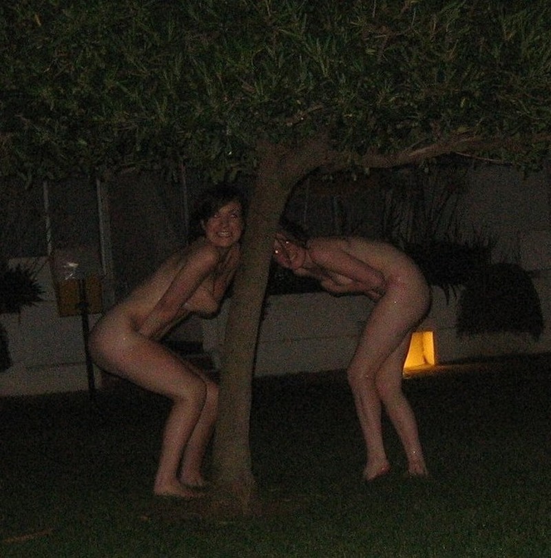 Embarrassed naked girl tied up outdoors