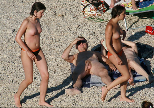 Nudist family at beach