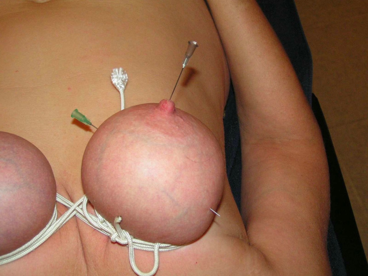 Mature pierced nipples tits