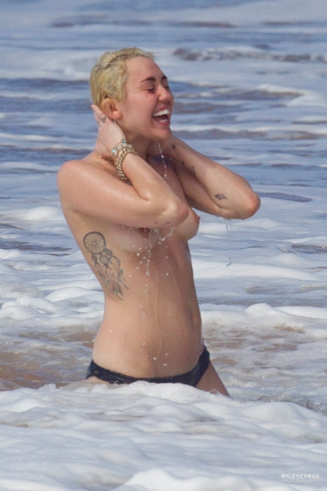 Miley cyrus topless beach