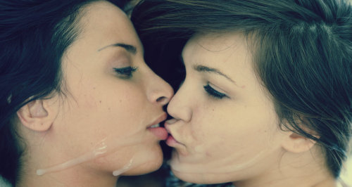 Two girls cum swap kiss