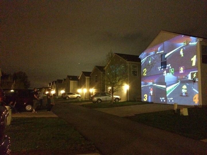 heartlessdivine: whiskey-neat: My friend just rigged it so she and her friends could play Mario Kart on the side of a house for someone’s birthday. Now the whole neighborhood can watch as a friendship is blown away by a blue turtle shell 