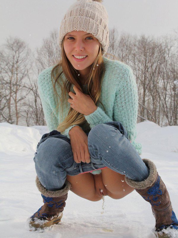 Blonde plays in the snow