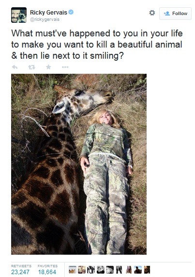 Woman hunter with dead giraffe