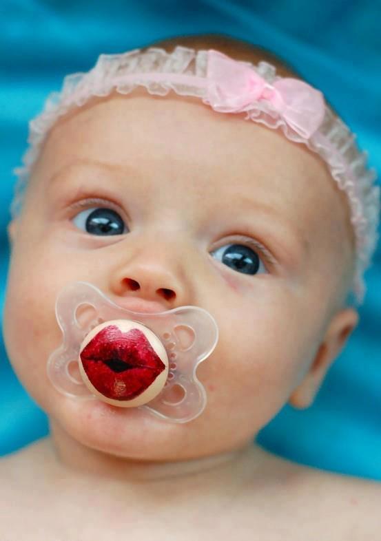 Cute baby girl pacifiers