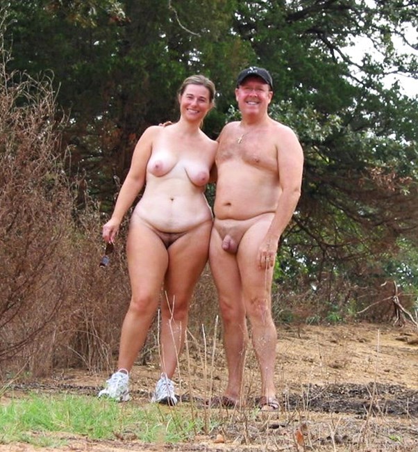 Mature naked couple outdoors
