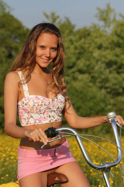 Girl riding bike in dress panty