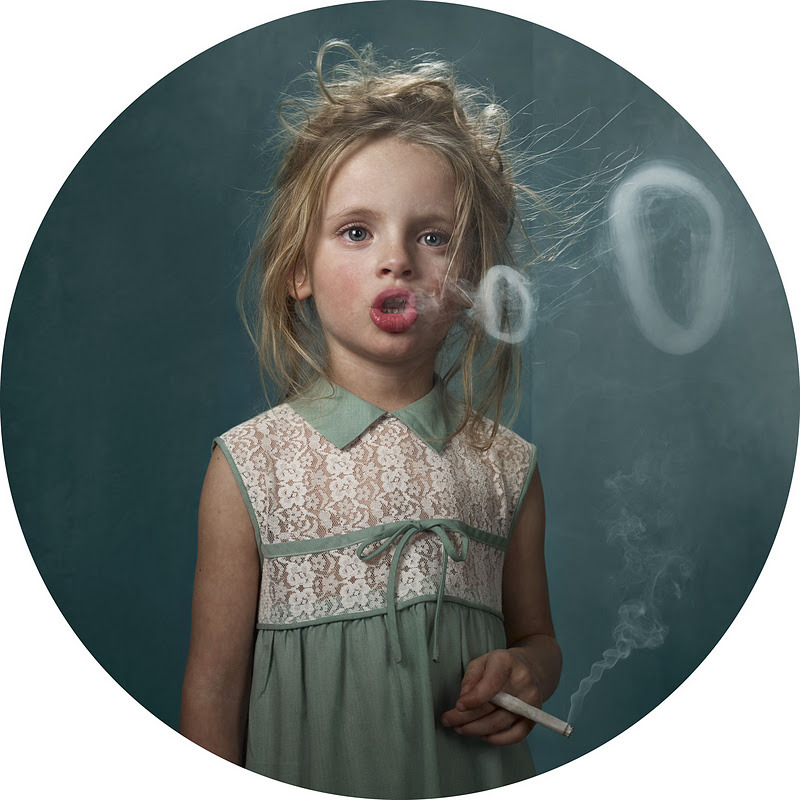 Young little girl smoking