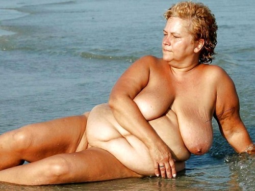 Naked granny on beach